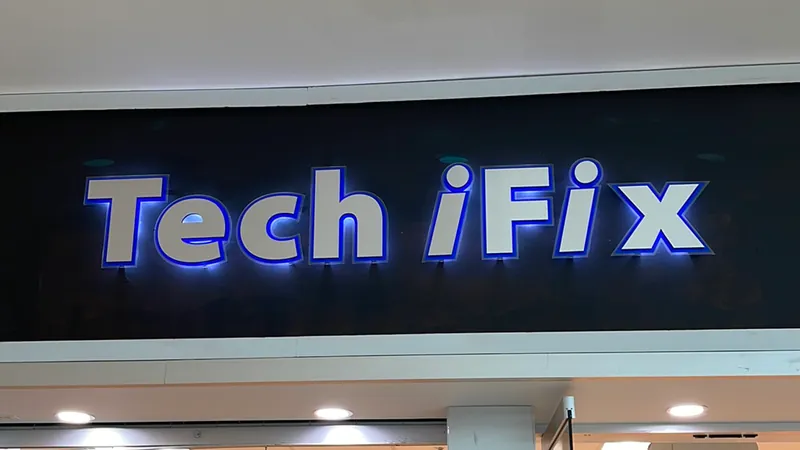 The lit Tech iFix sign above our store entrance at Hawthorn Mall