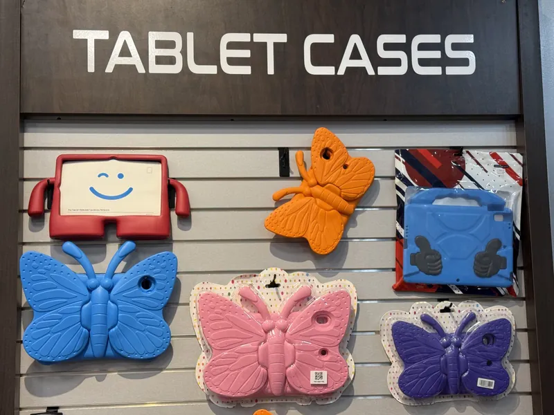 Kids' tablet cases, including butterfly and handle styles, on our tablet case wall